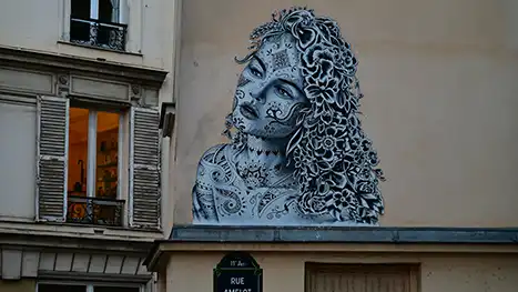 picture of a girl painted on building