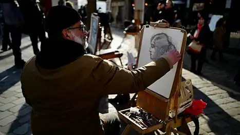 artist painting on the street