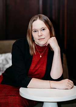 girl in business suit smiling at camera