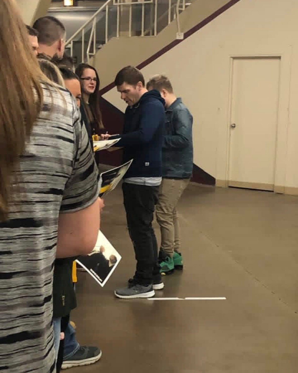 band members signing autographs
