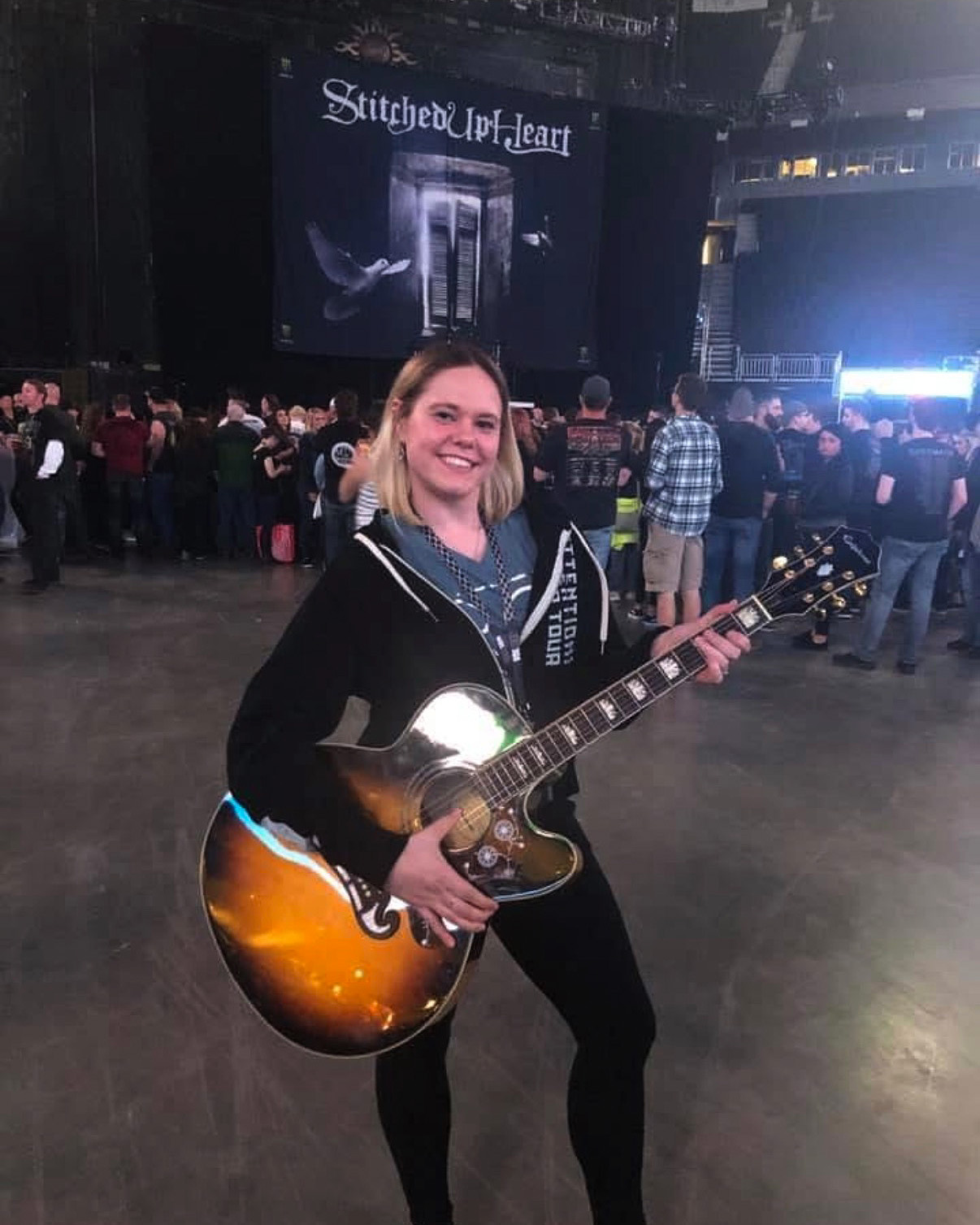 girl holding guitar