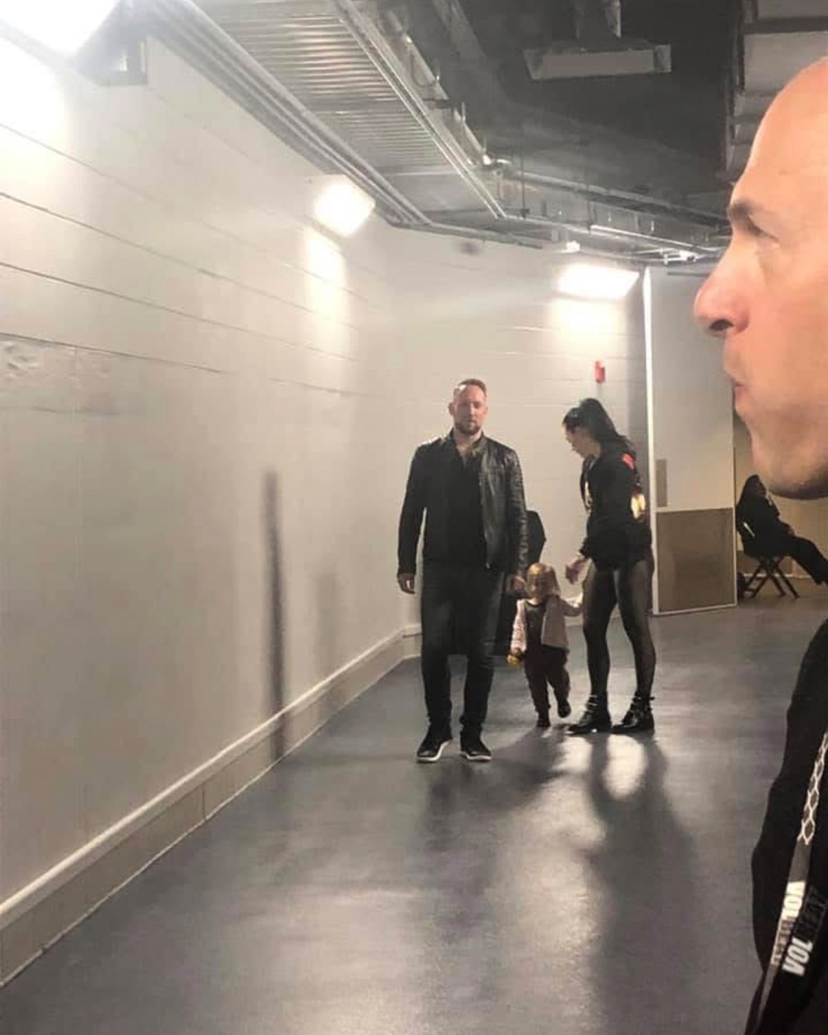 band member with family walking backstage